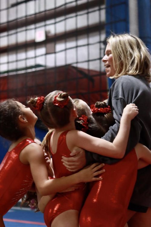 Gymnastics coach and team