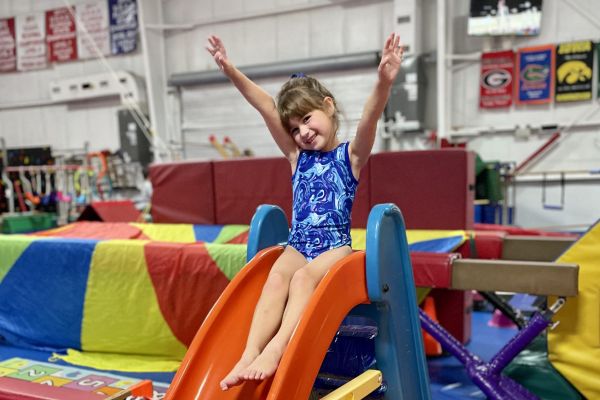 Young Gymnast playing on equipment